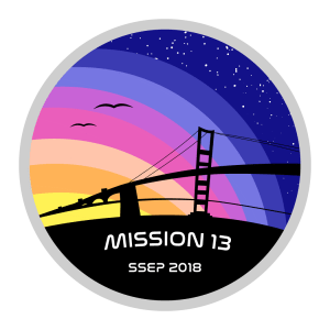 Terps in Space Mission 13 patch consisting of an sunset silhouette of the Maryland Bay bridge with the silhouette of birds flying near it